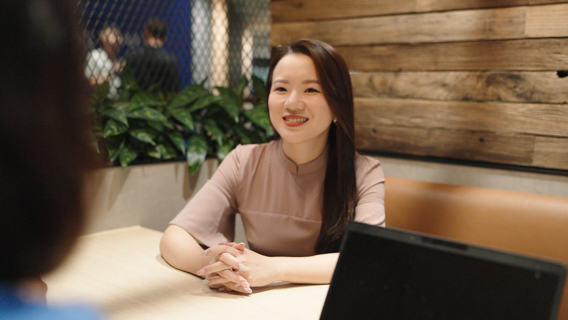 A person talking at a table