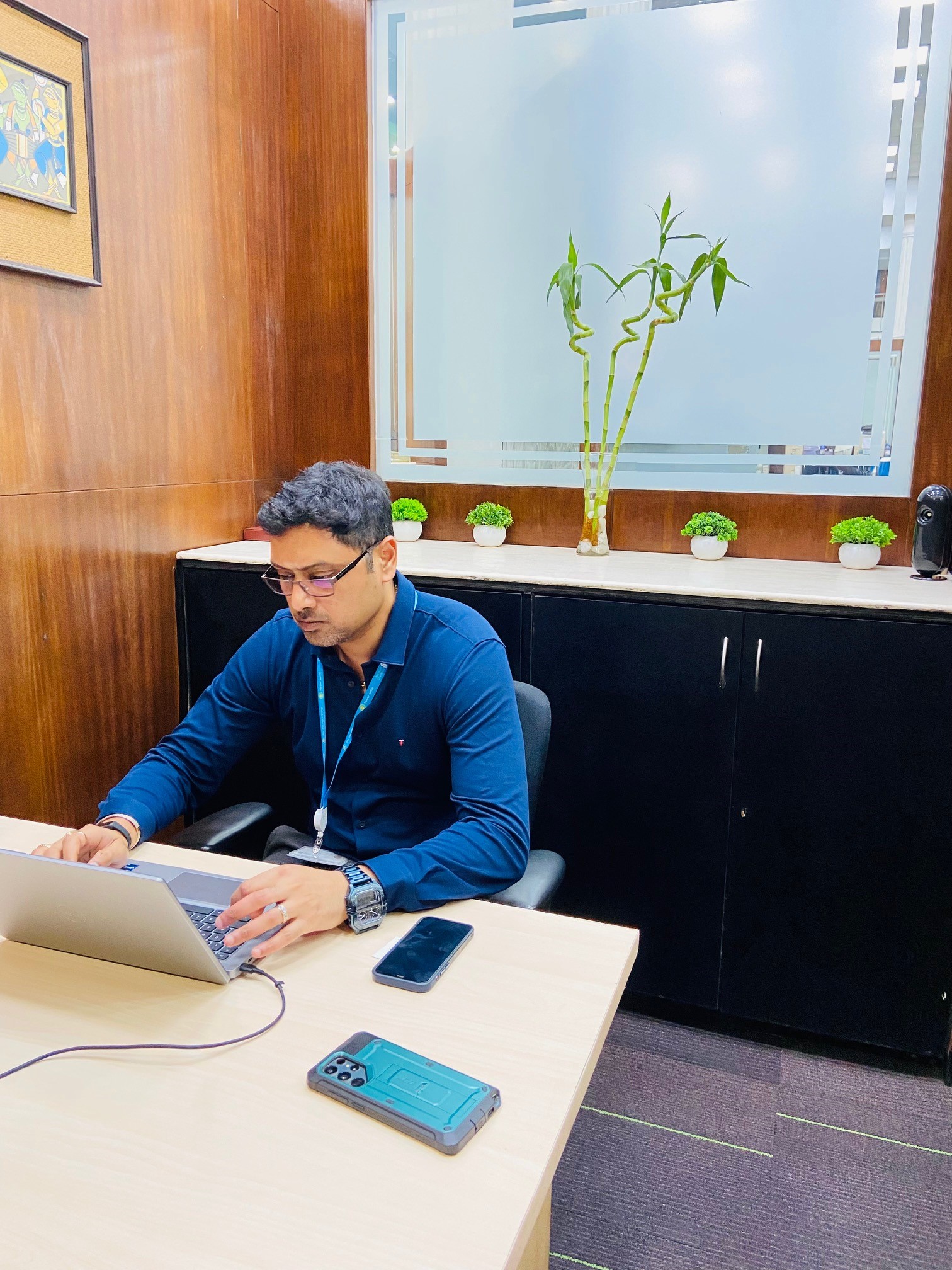 An employee working with his laptop