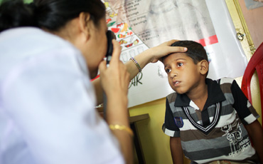 Standard Chartered Bank seeing is believing child in eye clinic