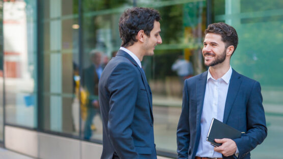 Two men discussing business