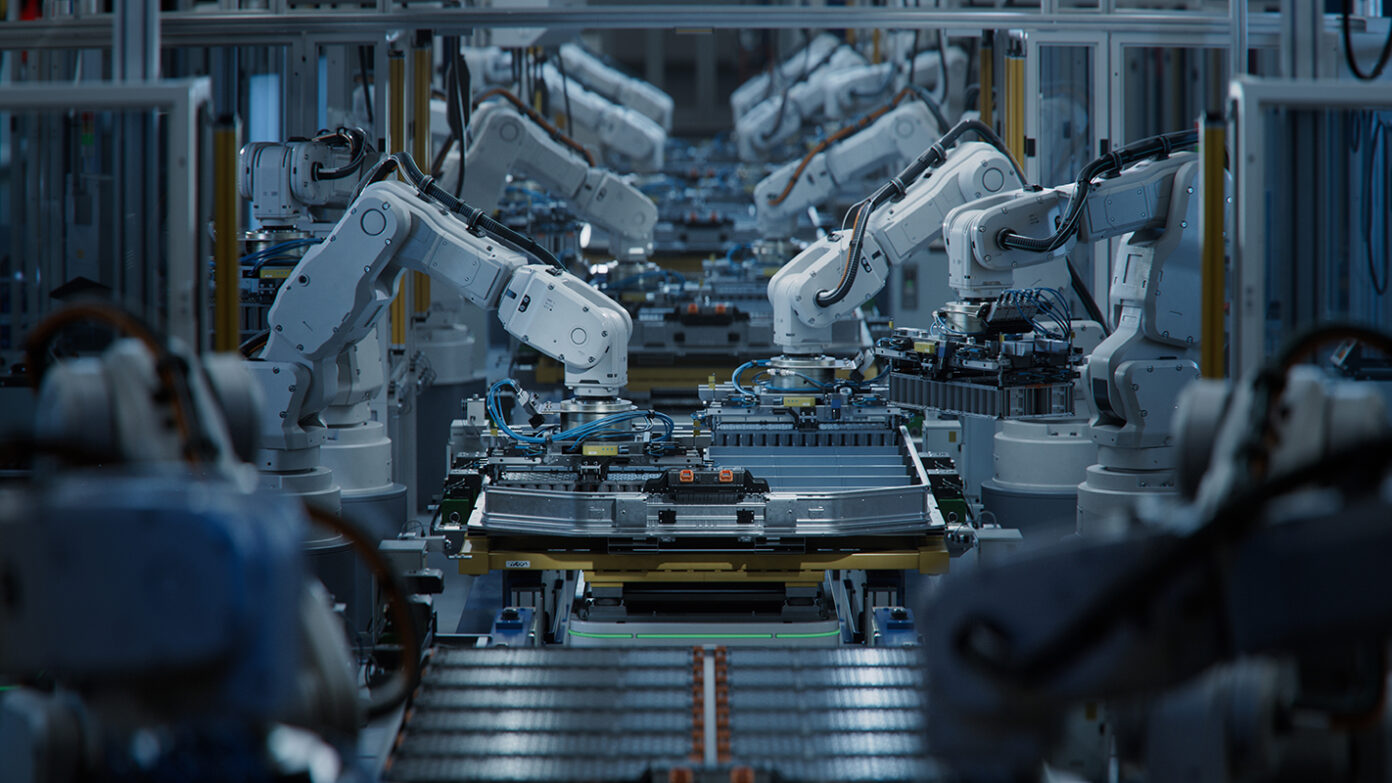 Robotic arms at an EV factory