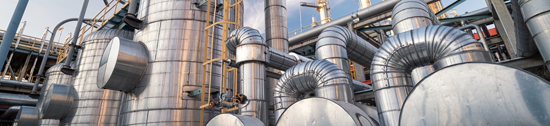 close-up image of a row of oil barrels