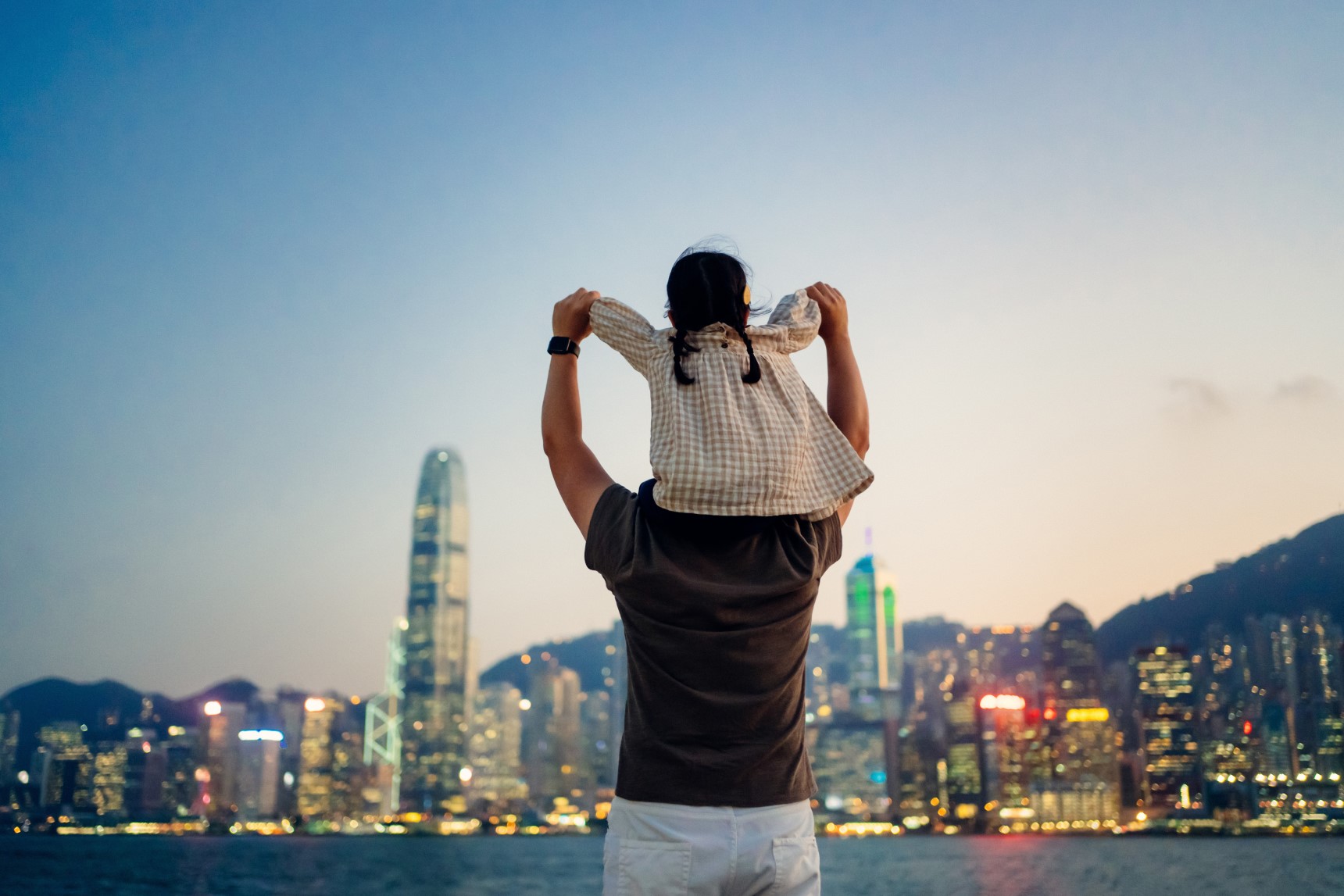 A man with a child sitting on his shoulders