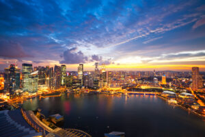 Aerial view of Marina Bay Skyline in Singapore at sunset.