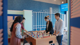 A group of people playing table top football