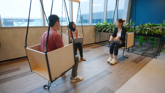 Colleagues sitting in a collaboration space