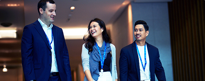 Three colleagues in Standard Chartered's singapore HQ.