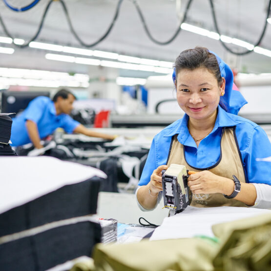 Woman smiling working in factory