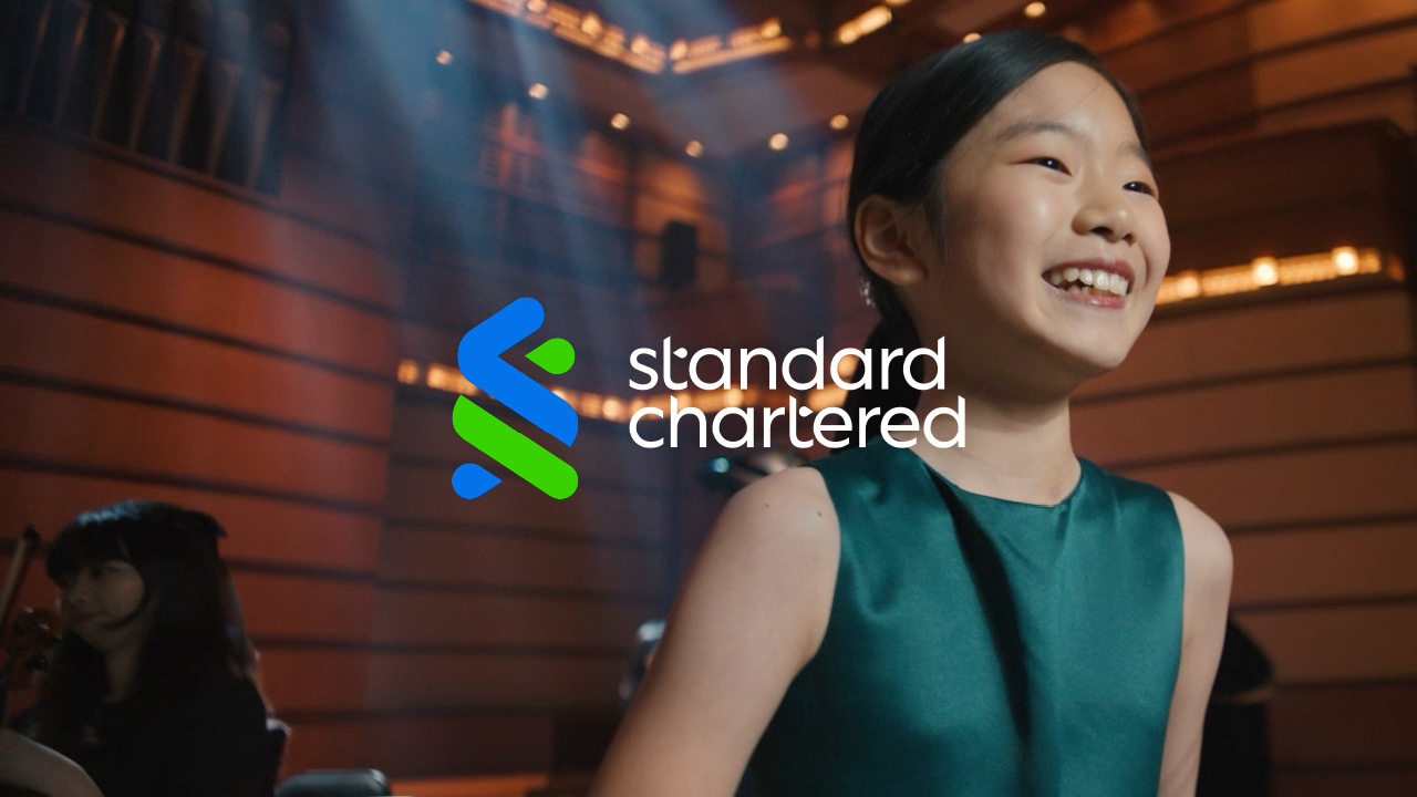 Violin prodigy Yeonah Kim smiles in the Standard Chartered 'Now is your time' film.