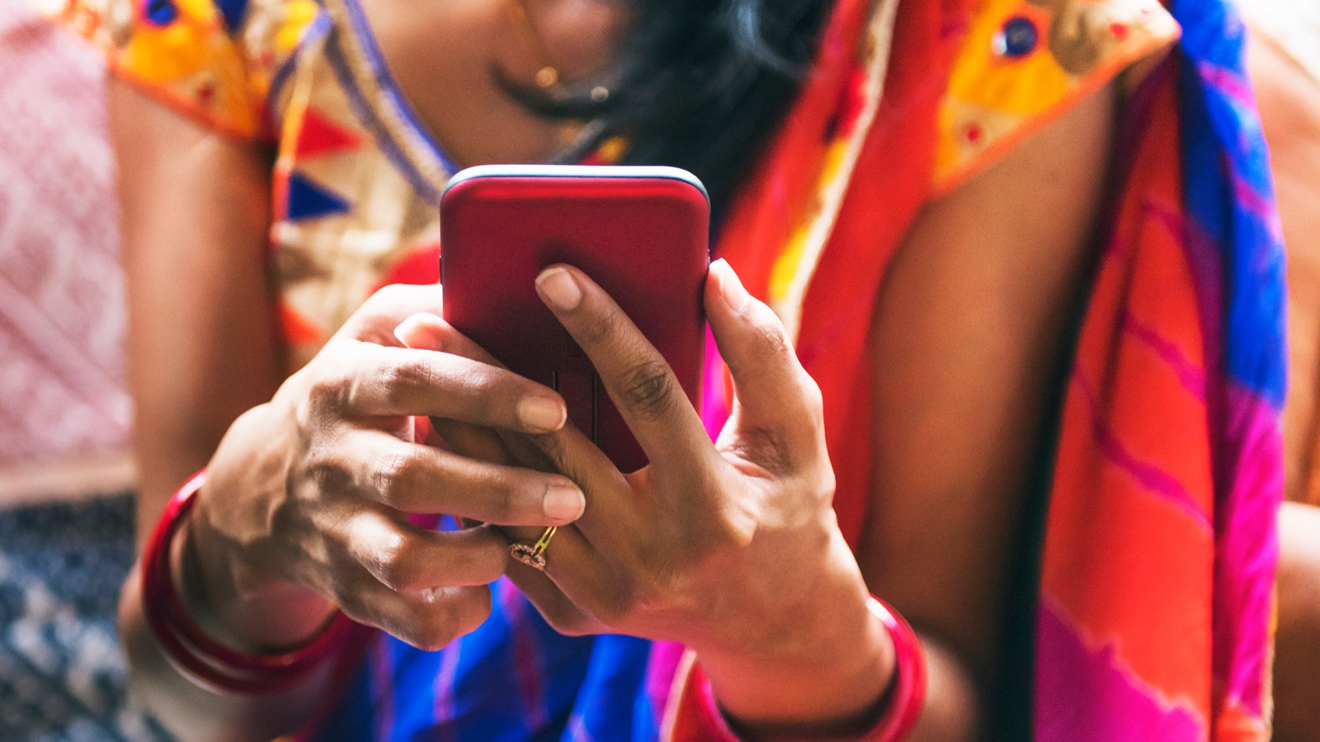 Lady holding smartphone close up