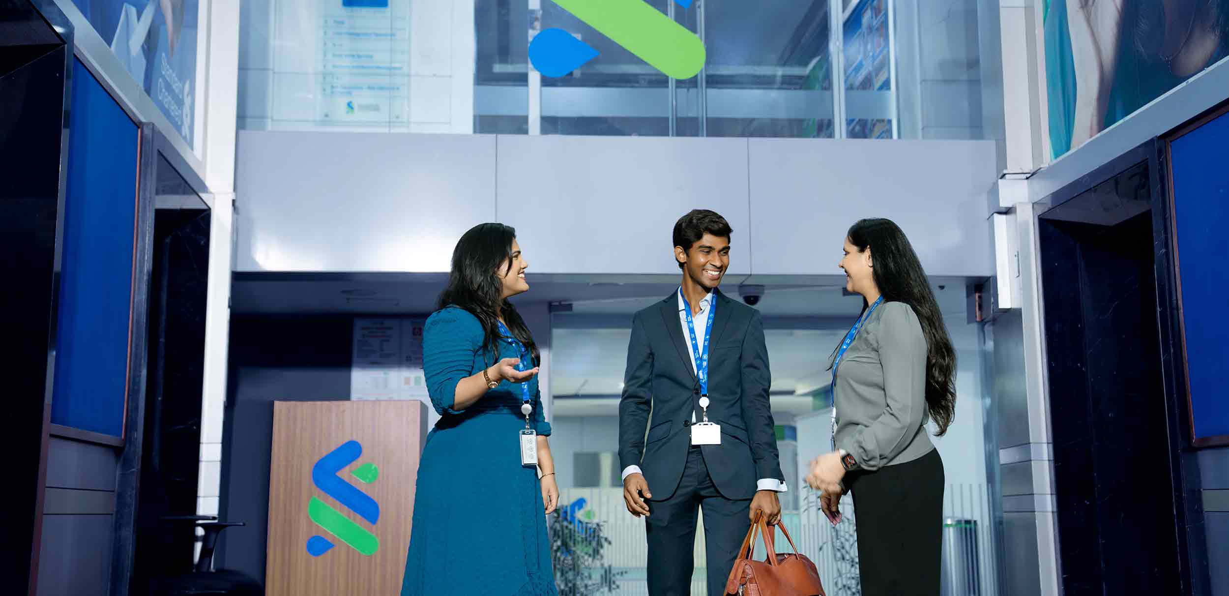 A group of people standing in a room