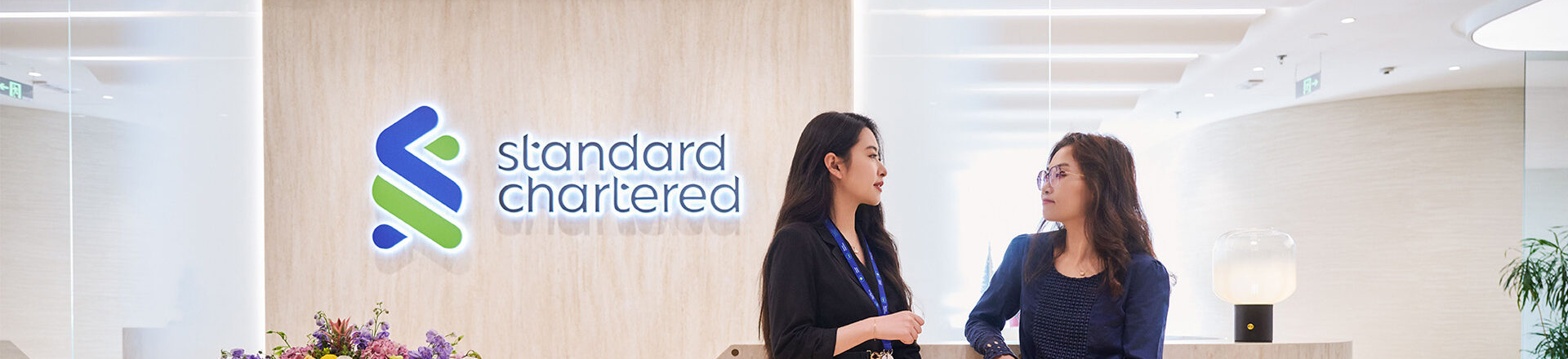 Two people talking in the reception