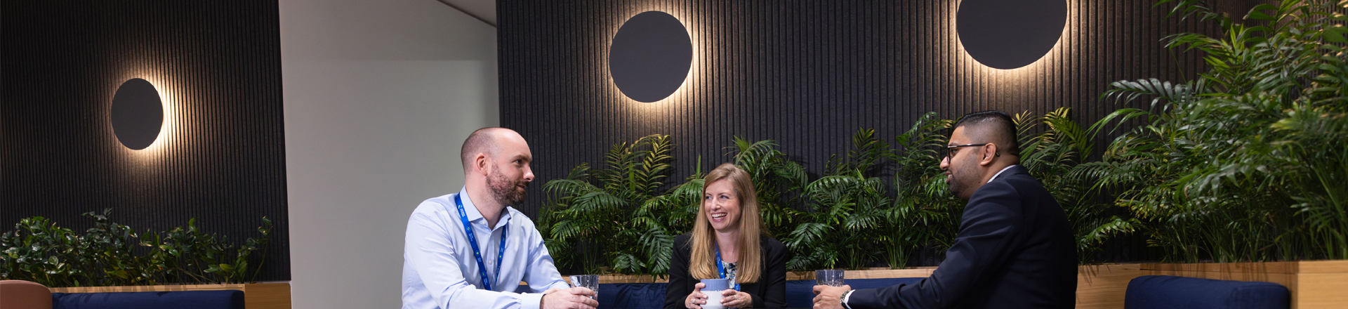 colleagues talking round a table