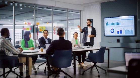 A group of people talking at the meeting