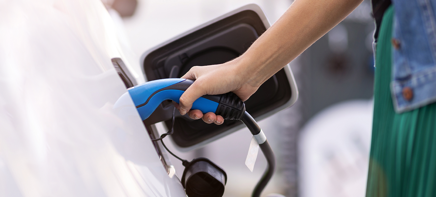Closeup of an person fueling the tank of a car