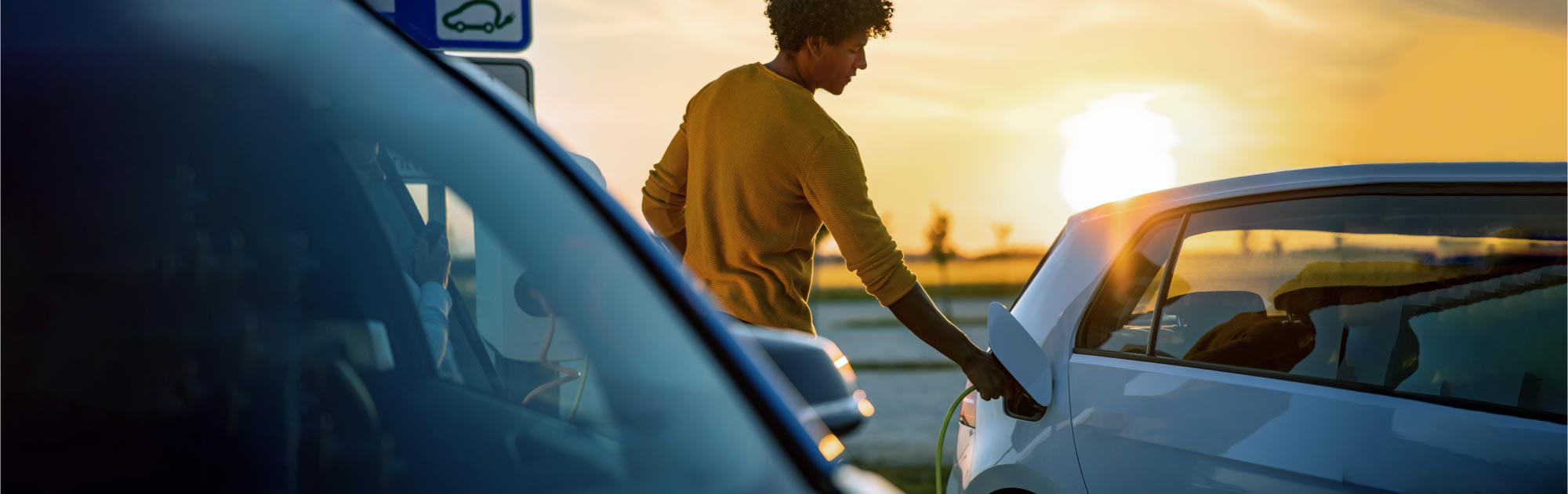 A man adding fuel to a car