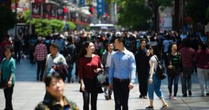 people walking through crowded city centre