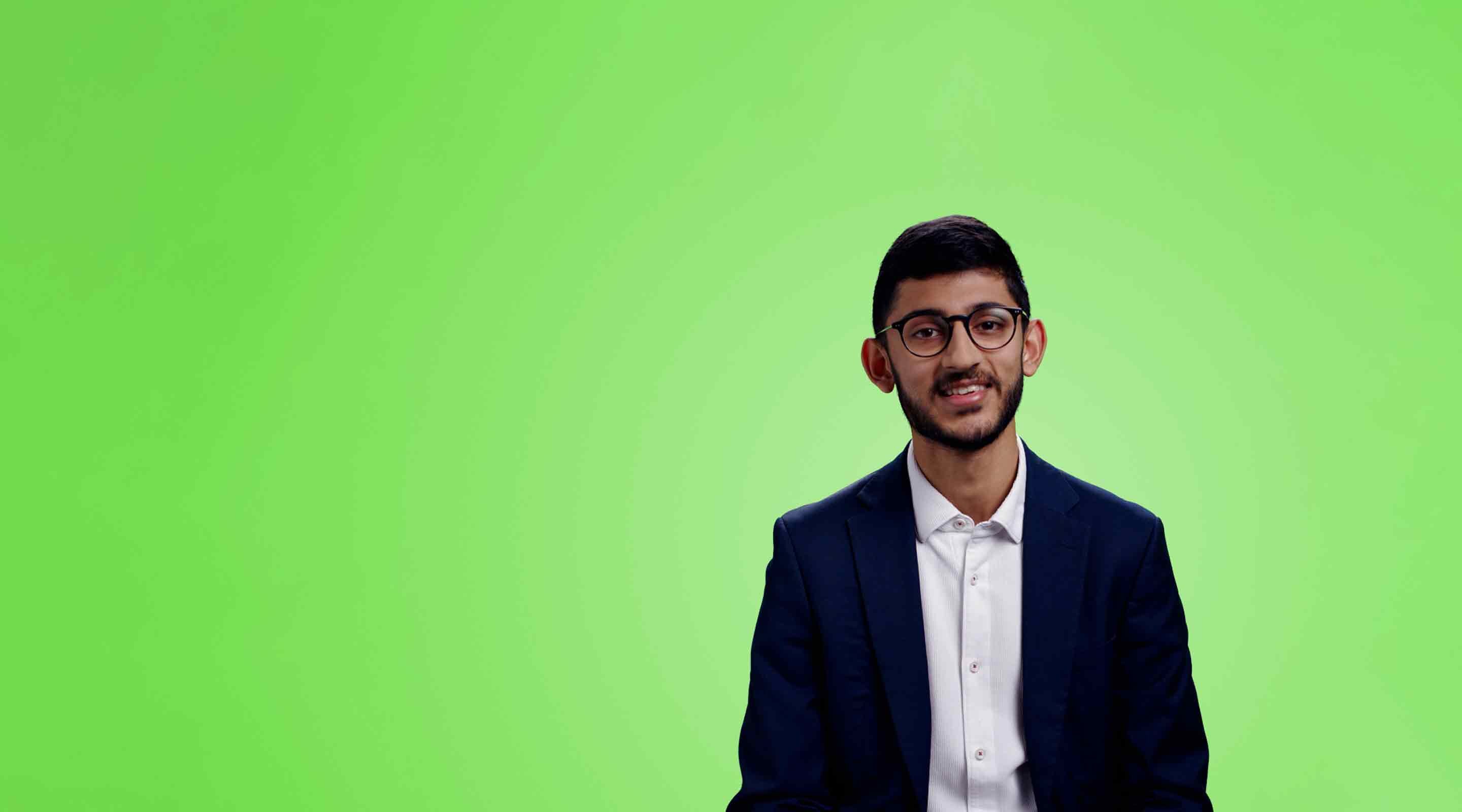 Man with glasses looking at the camera