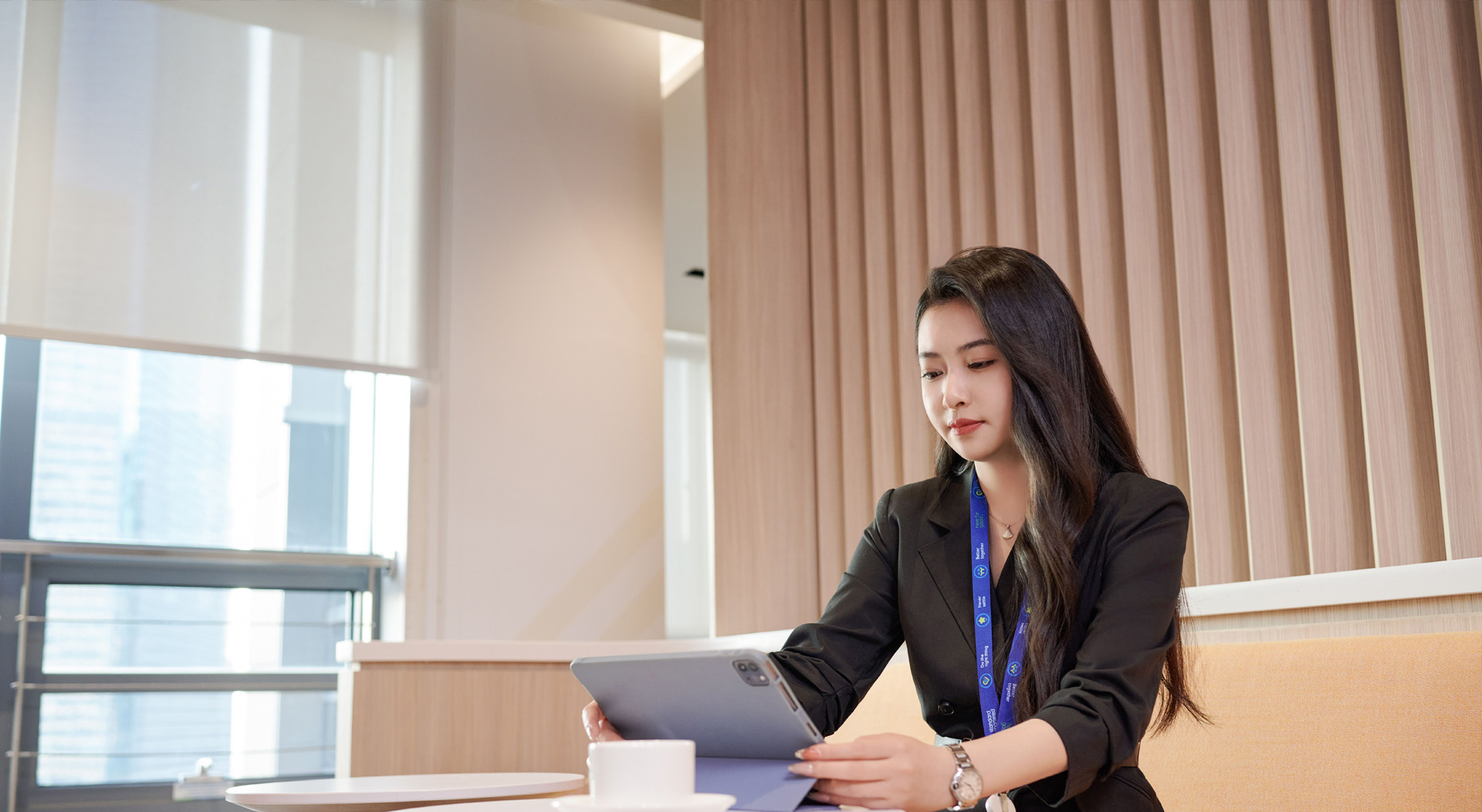 Women working in the office looking at an ipad