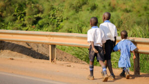 Three school children walking