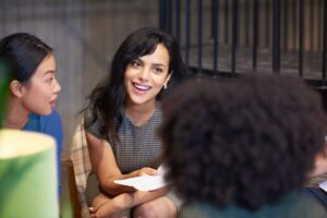 A lady talking with colleagues