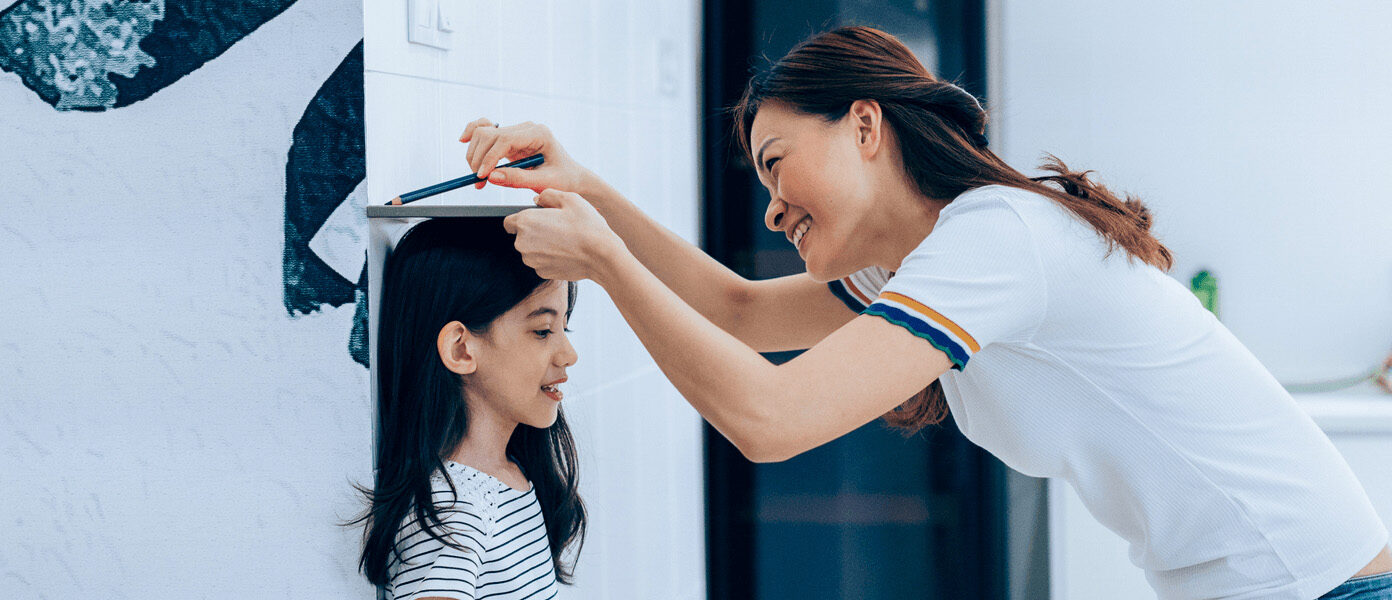 Girl getting height measured