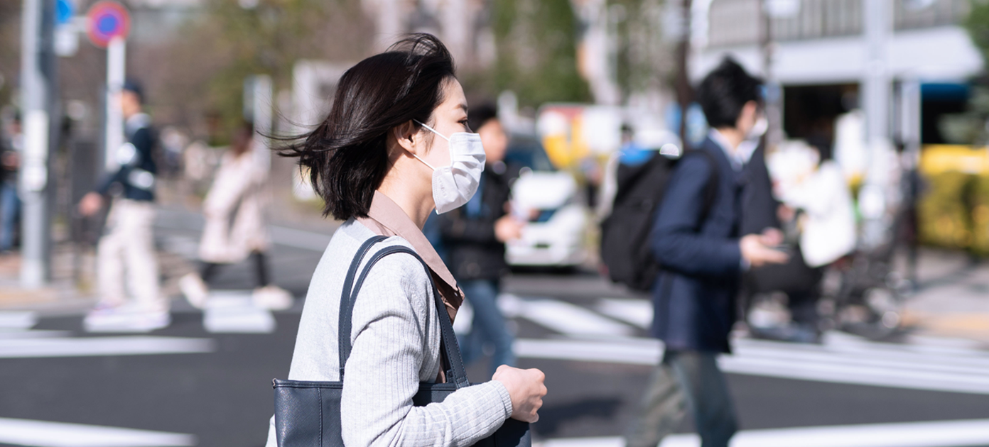 woman wearing mask walking