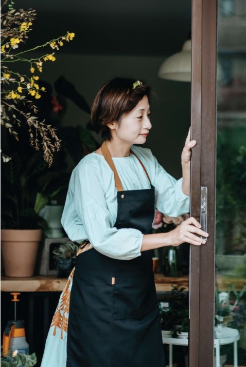 asian lady sliding open a door