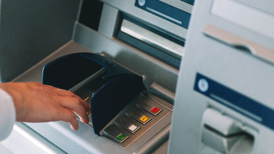 ATM skimming close up shot of pin entering