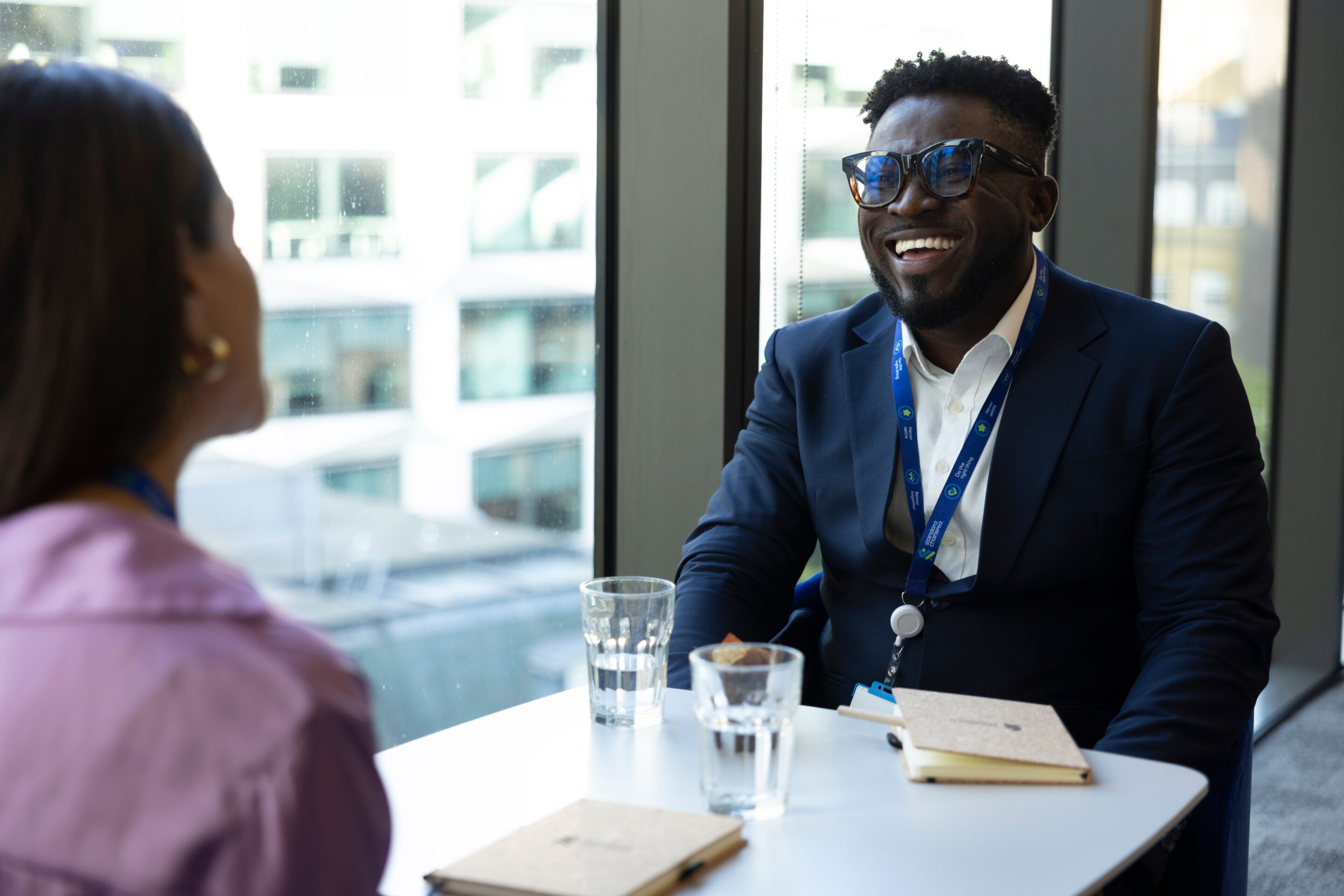 a man and woman conversing at work