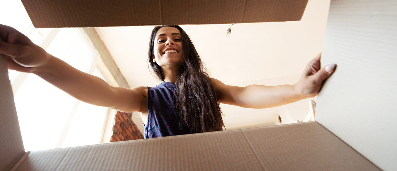 Image of woman opening a box