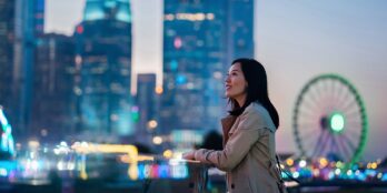 Person in front of cityscape 