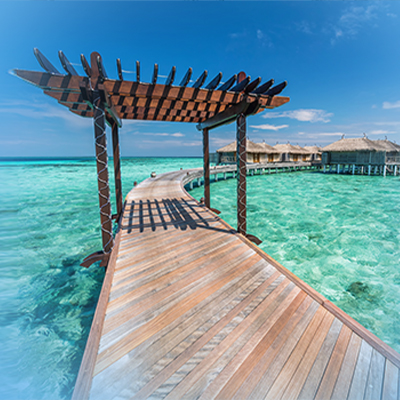 Gh wooden jetty towards water villas in maldives travel insurance x y