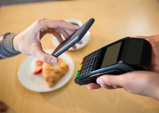 a mobile phone is used to pay bill to a POS machine