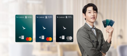 Song Junggi Oppa in grey suit holding 3 Cathay Mastercards with a smile