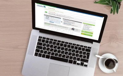 Laptop visiting standard chartered online banking website