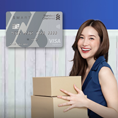 A lady is holding gifts, standard chartered Smart Card display on top left
