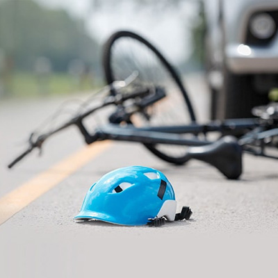 A helmet is left at the scene of a traffic accident