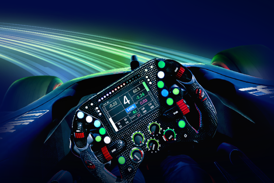 Race car cockpit with advanced steering wheel controls and digital dashboard.