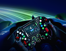 Race car cockpit with advanced steering wheel controls and digital dashboard.
