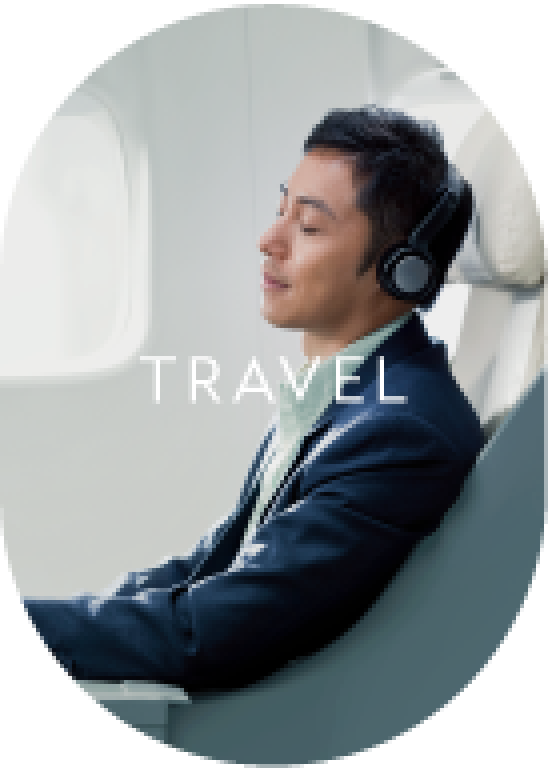 A man wearing headphones in a plane